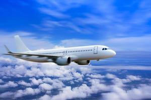 plane-in-the-sky-passenger-commercial-plane-flying-above-the-clouds-concept-of-fast-travel-vacation-and-business-photo